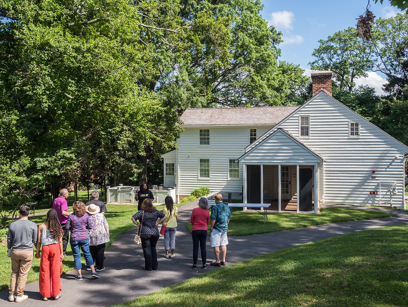 A group of visitors outside of the Josiah Henson Museum