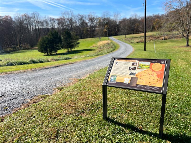 The gravel road leading to Newmantown area with interpretive signage